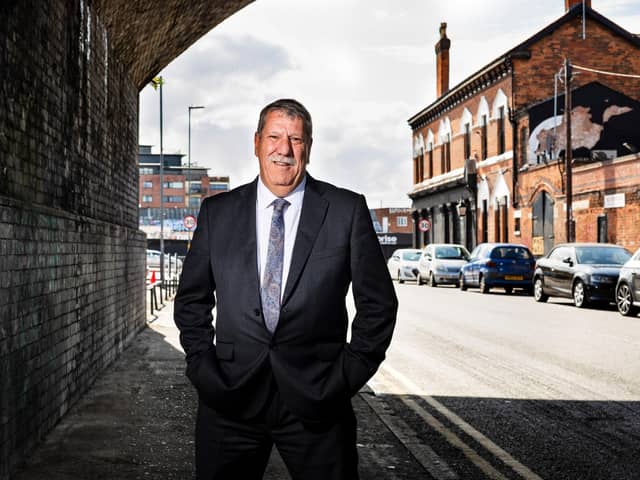 Carl Chinn underneath the railway arches in Adderley Street where the first Peaky Blinders assaulted an innocent man because he had been drinking a ginger beer in the Rainbow pub (seen in the background on the right).