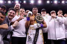 Bob Howard, to the left of Tommy Fury, celebrates victory in Saudi Arabia.