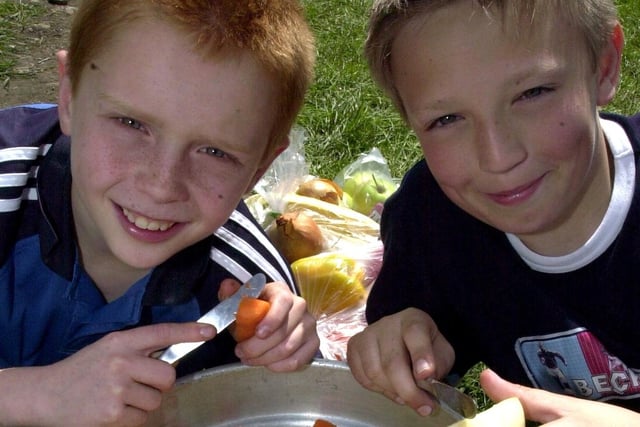Andrew Fisher and Thomas Boardman, of 1st Broughton Scouts, rustle up some grub at the scouts 'County Rally' held at Waddecar Scout Camp, Beacon Fell in 2003