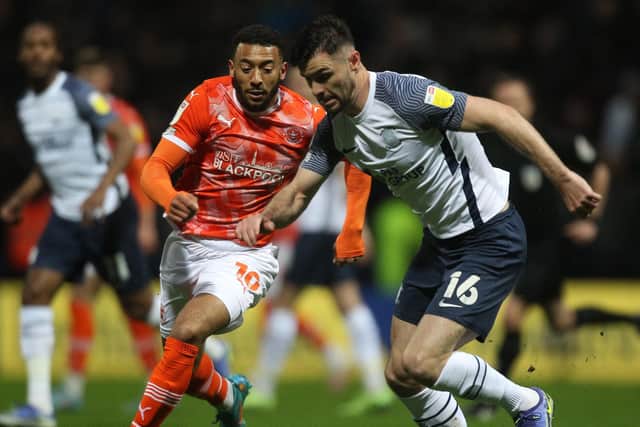 Preston North End's Andrew Hughes in action with Blackpool's Keshi Anderson.
