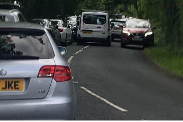 Locals say that there is already traffic chaos at school pick-up and drop-off times, like that pictured here on Church Lane last month (image: Charnock Richard Residents' Association)