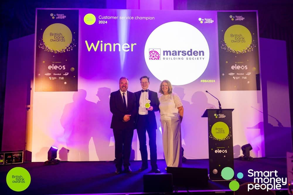 Marsden’s Phil Relf (centre) collecting the Customer Service Champion award