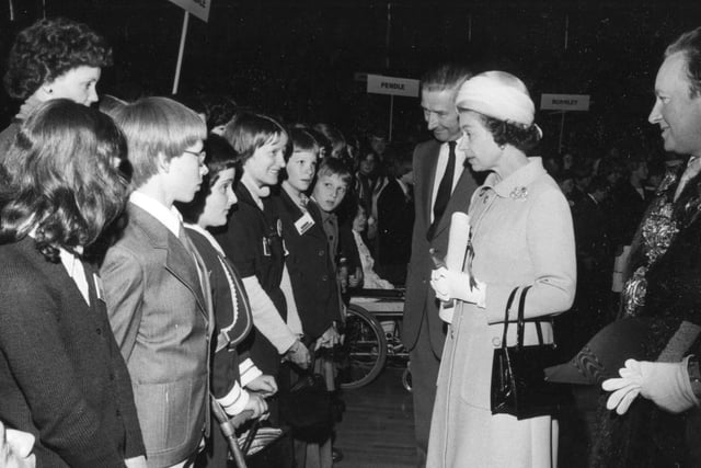 Queen Elizabeth chats to children from all over Lancashire who had put together an exhibition of arts and crafts during her 1977 visit