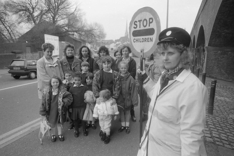 Parents are furious that a lollipop patrol guiding school children across a busy Preston road is to be axed. Hundreds of children are safely helped across the junction of Tulketh Brow and Waterloo Road under the watchful eye of lollipop lady Mrs Wendy Proctor. But police experts have decided the twice-daily peak hour patrol is to go. Mrs Wendy Proctor is pictured above with some of the parents and children