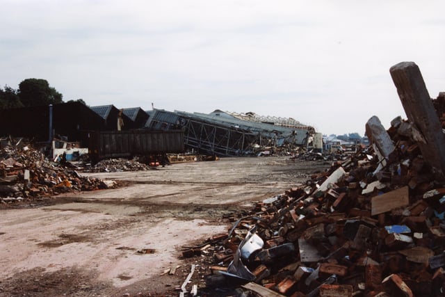Piles of rubble and twisted corrugated iron lay all around as the former BAE works on Strand Road is demolished in 1994
