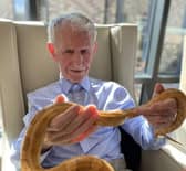 Resident holding a snake