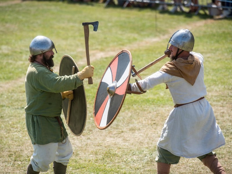 Heysham Viking Festival 2026 - two opposing Vikings sparring with axes and shields.