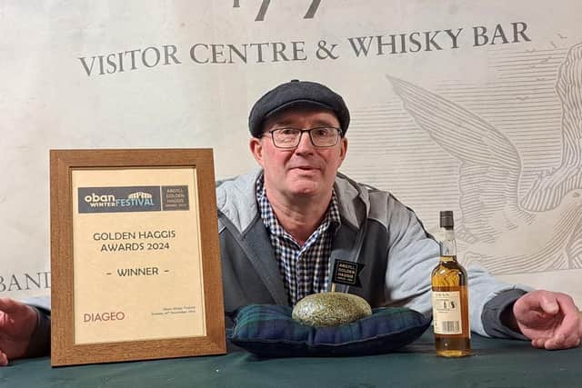 Sean Gibson with the prized haggis.