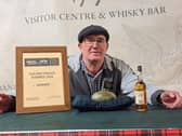 Sean Gibson with the prized haggis.