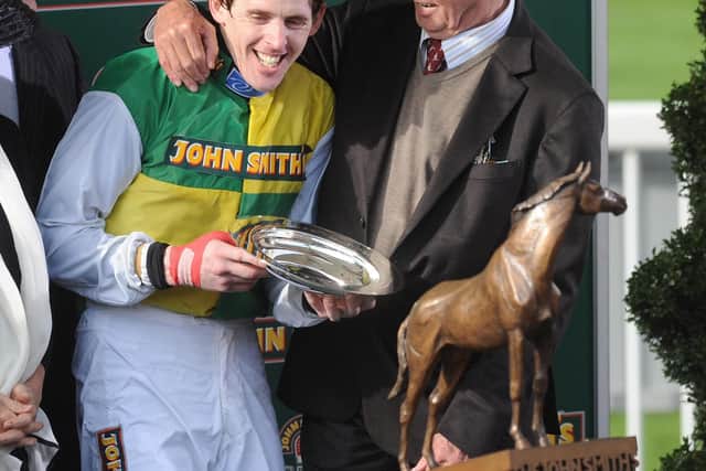 Ballabriggs owner Trevor Hemmings (right) and jockey Jason Maguire celebrate their Grand National victory in 2011
