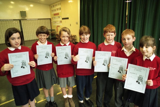 Young readers at Brindle's Gregson Lane County Primary School, near Chorley, have hit the headlines after scoring a success in an Evening Post newspaper project. The successful young newshounds, pictured above, were rewarded for their efforts with Passport to Reading certificates
