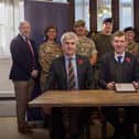 Gary Oakford from the Ministry of Defence hands Stonyhurst a bronze award for its commitment to the Armed Forces Covenant (AFC).