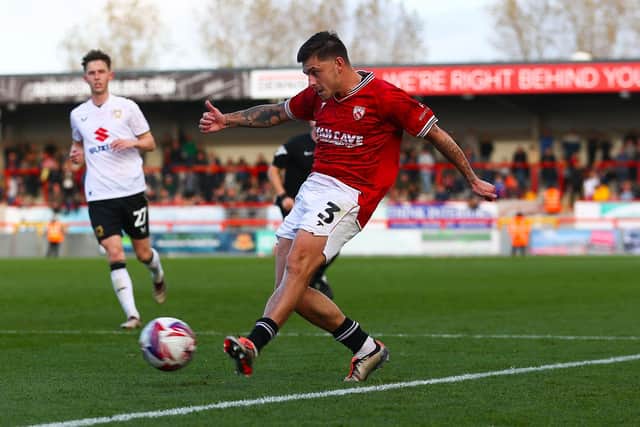 Morecambe's Adam Lewis in action during their defeat against MK Dons (picture: Morecambe FC)