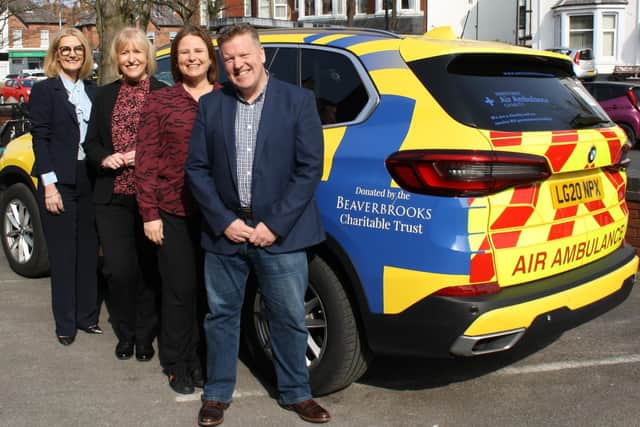 Heather Arrowsmith (CEO at North West Air Ambulance Charity), Susie Nicholas (Beaverbrooks Charity Manager), Anna Blackburn (Beaverbrooks Managing Director) and Paul Holly (Beaverbrooks Head of Community Responsibility) in front of the new Critical Care Vehicle for the North West air ambulance