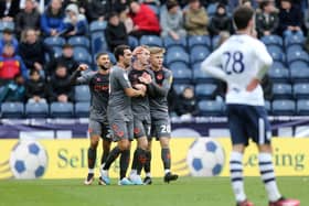 Bristol City players celebrate scoring the opening goal