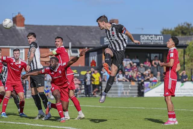 Captain Mike Calveley heads home Chorley’s winner against Scarborough