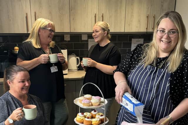 Staff at Westmorland Homecare's Lancaster and Morecambe branch preparing for the coffee afternoon