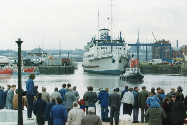 The Manxman being pulled into Preston Dock, watched by a big crowd in 1982