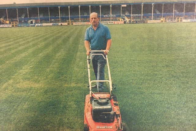 Preston North End groundsman Peter McCallion prepares the pitch for the team's first game back at Deepdale after the plastic pitch was removed in the summer of 1994.