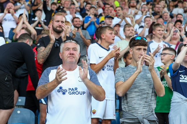 North End fans support their team wearing their colours.