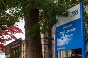 A man was treated for a head injury after a car smashed into a building at Royal Lancaster Infirmary