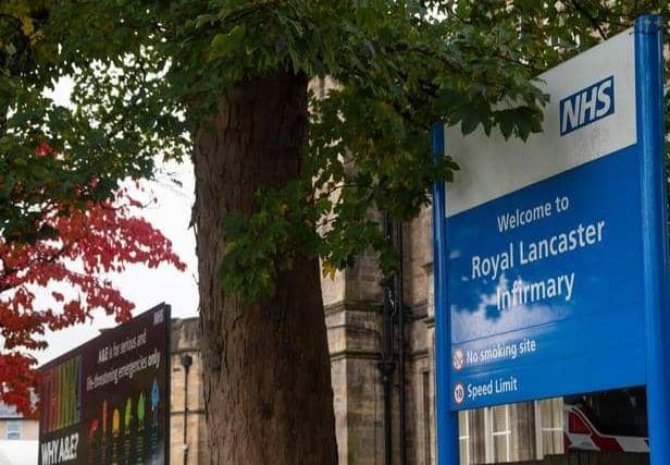 A man was treated for a head injury after a car smashed into a building at Royal Lancaster Infirmary