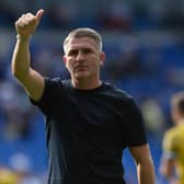 Preston North End manager Ryan Lowe applauds the fans at the final whistle.