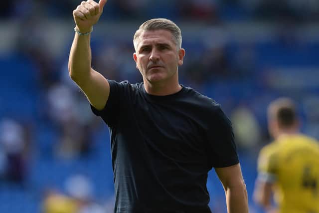 Preston North End manager Ryan Lowe applauds the fans at the final whistle.