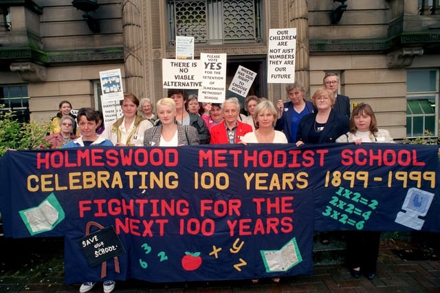 Supporters of Holmeswood Methodist School near Rufford protest outside County Hall in Preston before the vote on the possible closure of the school