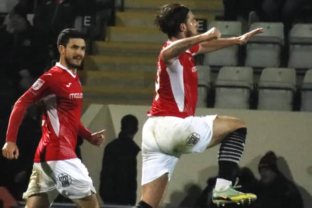 Cole Stockton celebrates scoring for Morecambe against Exeter City on Friday Picture: Ian Lyon