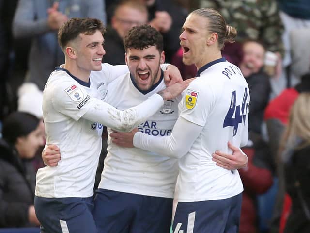 Preston North End's Tom Cannon celebrates with teammates after scoring his side's second goal