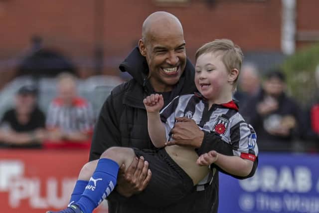 Andy Preece with a young Magpies fan (photo: David Airey/dia_images)