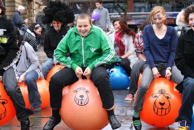 Twenty members of the youth group from Carey Baptist Church climbed on giant orange space hoppers for a sponsored bounce on Preston Flag Market