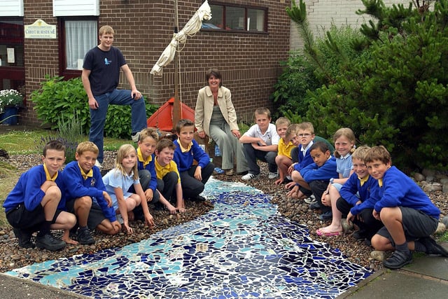 Some of the pupils from St Peters Catholic Primary School, Lytham, who helped make a "Garden for St Peter" in the school grounds. Also pictured are parent Cath Powell (who landscaped the garden) and Joseph Thompson (from the artlounge, Lytham) whose mother Nicola worked on the mosaic