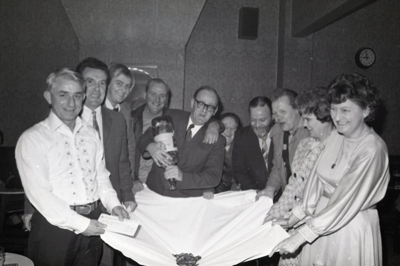 A gallon of pennies was collected up by generous customers at Preston's Cemetary Pub. Pictured here is the money being counted before being presented to charity