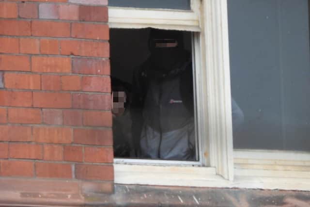 At least one of the young intruders is maksed, while another hides under a hoody