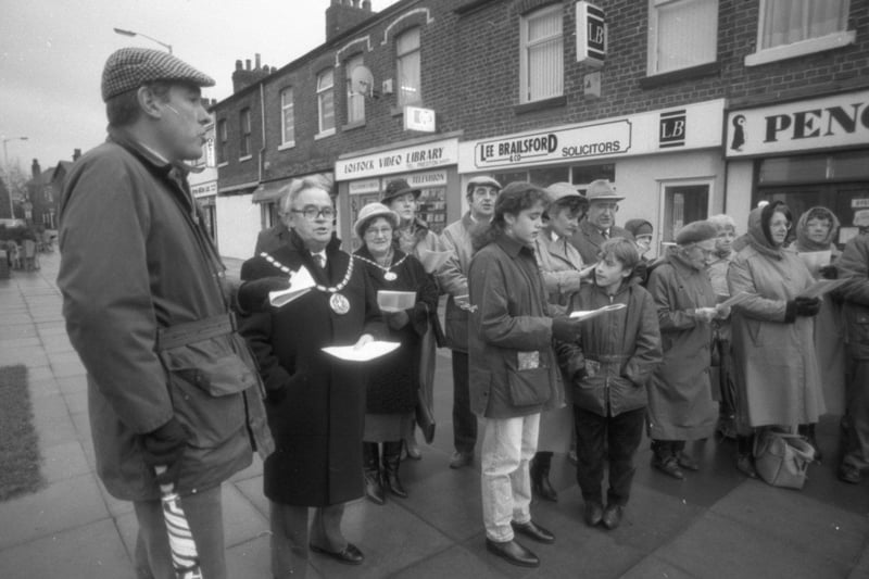 Carol singers braved the wintery weather to mark the beginning of Christmas festivities in a Lancashire village. Residents of Lostock Hall, near Preston, gathered in the shopping precinct for a carol service hosted by the village's four churches. Guests included the Mayor and Mayoress of South Ribble, Coun and Mrs George and Dorothy Woods, and music was provided by members of the Lostock Hall Memorial Band