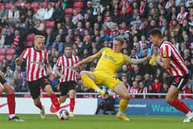 Preston North End's Emil Riis battles with Sunderland's Danny Batth and Alex Pritchard.