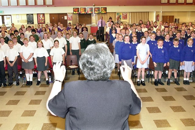 Youngsters from the area gathered at Lytham St Annes High School to take part in a singing workshop. Pictured: Music Service project leader Stella Jackson conducts the children