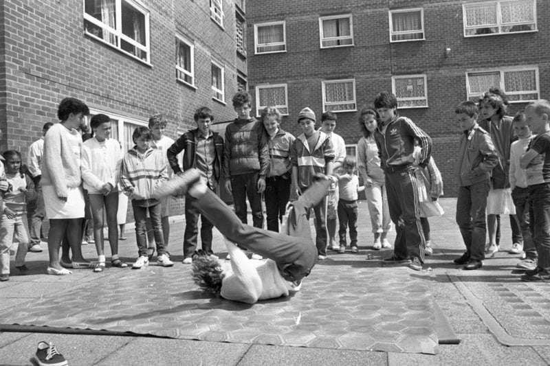 An afternoon of fun and music could mark the turning point for the residents of a strife-torn flats complex. Their summer festival may not have been as lavish or big as many Lancashire carnivals but in many ways it was more important. For the people who live in three high-rise blocks on Moor Lane, Preston, it was an important step towards creating community spirit in a place where it has been sadly lacking. Pictured: A group of lads calling themselves 'Level One' gave demonstrations of breakdancing