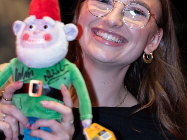 Signed Norbot toy with a happy attendee