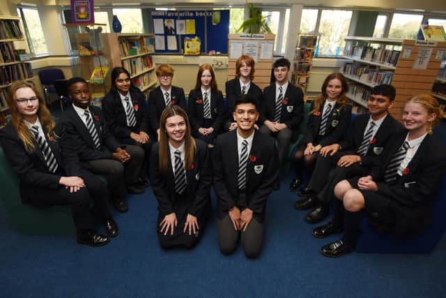 Broughton High School is celebrating an outstanding Ofsted report. Pictured: the head boy and head girl with the team of deputies.