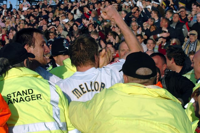 Neil Mellor celebrates his goal with the Preston North End fans at Bloomfield Road during the PNE v Blackpool game in 2008
