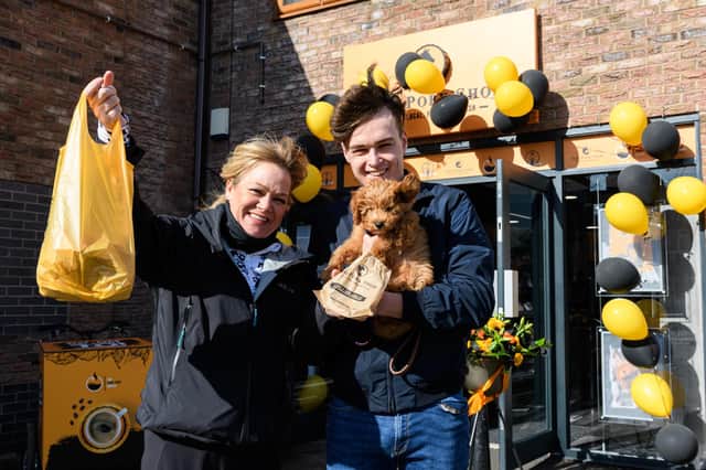 Michelle and Will Evans with dog Monty and their purchases from The Pork Shop