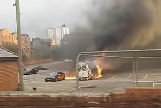 Pictures from the scene show the FedEx van engulfed in flames with the fire spreading to a BMW parked next to it, melting its rear bumper. (Picture by Somewhere in Preston)