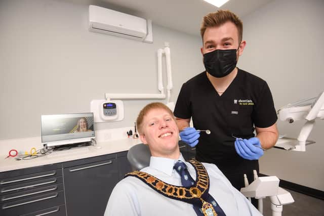 Dr Chris Ball from Dentistry by Cure Clinics is offering free checkups until mid September. He is pictured with Preston mayor Neil Derby.
