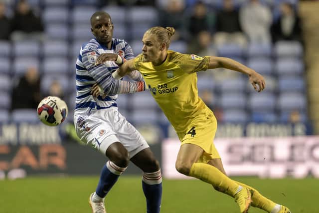 Preston North End's Brad Potts (right) battles with Reading's Lucas Joao (left)