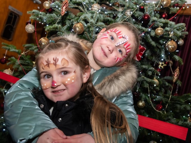 Festive candy canes and reindeer face paints for this duo