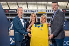 Kevin McGuinness presents Mick Baxter's PNE shirt to members of Mick's family at Deepdale. Pic: Ian Robinson/PNEFC