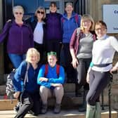 A long way to go for a drink but all in a good cause, Joy (back row, far right) and Margaret (front row, second from the right) with some of those who joined them on their annual charity 10 mile, 10 pub walk this year
